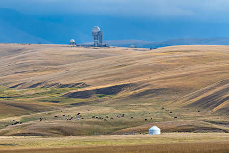 Assy plateau in Kazakhstan with abandoned Soviet observatory and a nomadic tent.