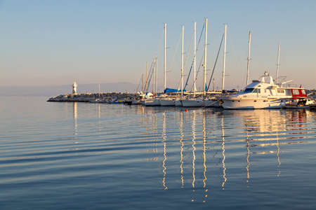 Boats in the harbor of the town Kucukkuyu along the Aegean Sea, Turkey