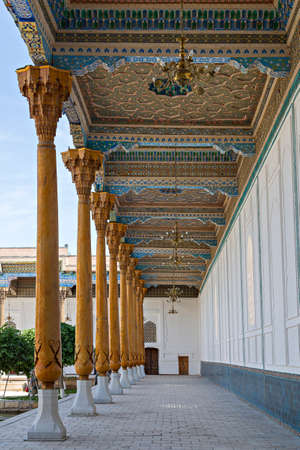 Wooden pillars and decoration in the courtyard at the Naqshbandi Mausoleum complex in Bukhara,...