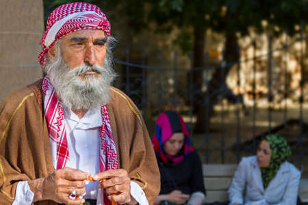 Local man in traditional dresses plays with his prayer beads in Sanliurfa, Turkeyのeditorial素材