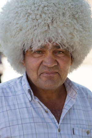 Man wearing traditional local hat known as Tilpak in Khiva, Uzbekistan.のeditorial素材