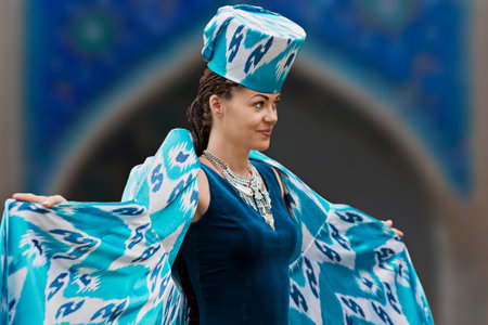 Model presenting traditional clothes and hats of Uzbekistan, in Bukhara, Uzbekistan.のeditorial素材