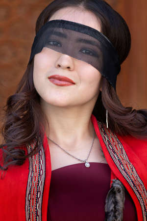 Portrait of a Uzbek woman with a mask on her eyes, in Tashkent, Uzbekistan