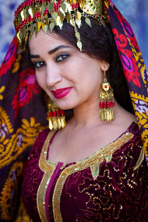 Uzbek woman in traditional clothes, in Khiva, Uzbekistanのeditorial素材
