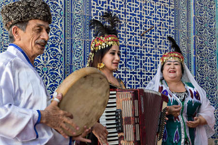Khorezmian musicians in local dress playing local music and dance, in Khiva, Uzbekistanのeditorial素材