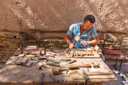 Artist carving the wood in Khiva, Uzbekistan.のeditorial素材