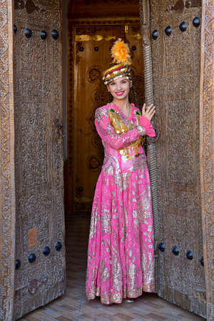 Uzbek woman in traditional clothes, in Khiva, Uzbekistanのeditorial素材