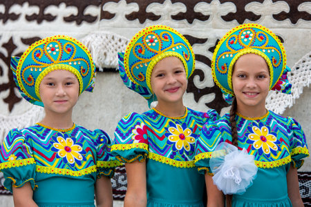 Kyrgyz children dressed up to perform during the Independence Day which is national feast, in Ala Too Square,  Bishkek, Kyrgyzstanのeditorial素材