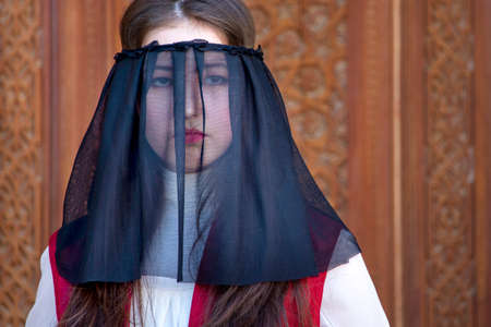 Portrait of Uzbek woman with veil on her face in Tashkent, Uzbekistanのeditorial素材