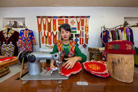 Uzbek woman sewing traditional local felt hats in Nukus, Uzbekistanのeditorial素材