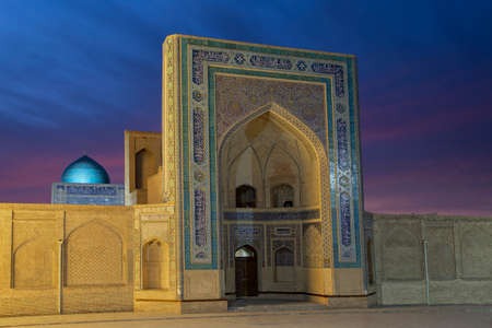 Gate to the Poi Kalon Mosque at the twilight in Bukhara, Uzbekistanのeditorial素材