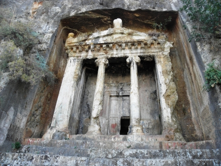 Rock tombs resembling the facade of the ancient temple of Telmessos now Fethiye on the Mediterranean...