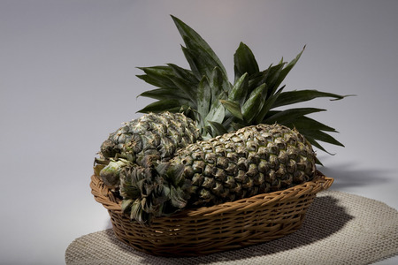 Pineapples in a basketの写真素材