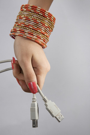 A woman holding plug-ins
