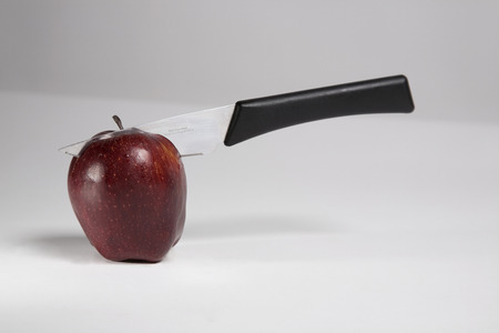 Apple with a knifeの写真素材