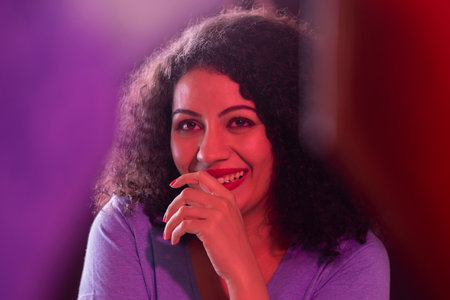 Close-up portrait of young woman looking away with smile