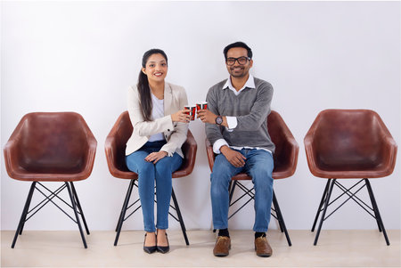 Office colleagues in rest room with coffee cups during leisure periodの写真素材
