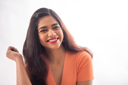 portrait of a young woman looking elsewhere and smilingの写真素材