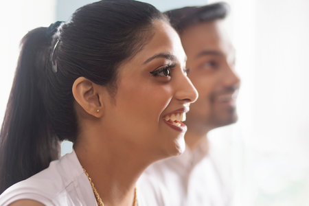 Two co-workers listening attentively during meetingの写真素材