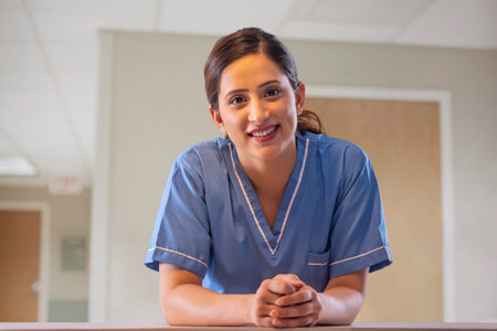 Portrait of a smiling Indian female nurse in hospitalの写真素材