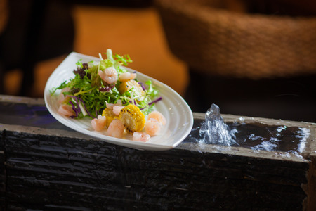 A plate of shrimp and cornの写真素材