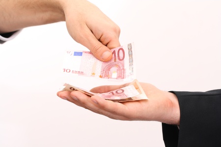 counting money with two human hands paying in cach moneyの写真素材