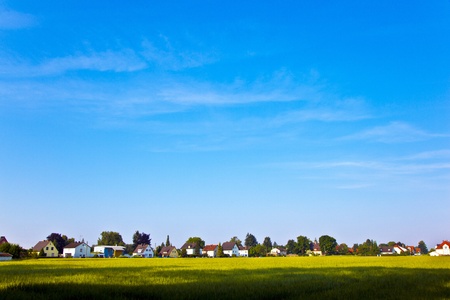 new housing area near the meadow in beautiful landscapeの写真素材