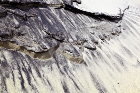 wind forms beautiful structures in the dunes at the beachの写真素材