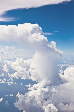 puffy white cloud blue skyの写真素材