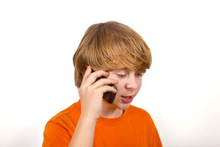 boy is using the mobile and speaksの写真素材