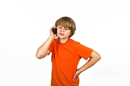 boy is using the mobile and speaksの写真素材