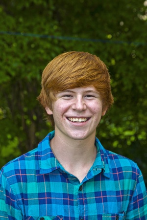 portrait of cute smiling young man  in the garden