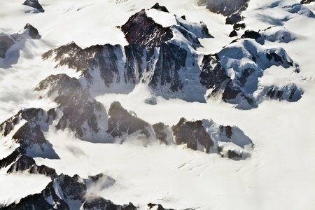 Aerial view of the antarctica with glaciers, mountain, snow and riverの写真素材