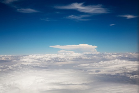 birds view from the plane to wonderful structured clouds like a ship in heaven