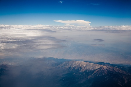 birds view from the plane to wonderful structured clouds like a ship in heaven