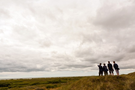 group of boy scouts are exploring the islandの写真素材
