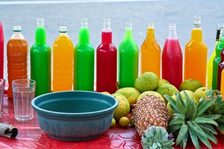 colorful fresh Fruit drinks are sold on the street with fruits in front