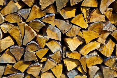 old Firewood stapled in the gardenの写真素材
