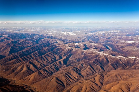 beautiful view from the aircraft to the mountains of the Himalaya on Chinese Tibetan side snowの写真素材
