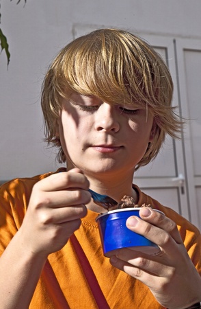 boy enjoys icecream in summerの写真素材