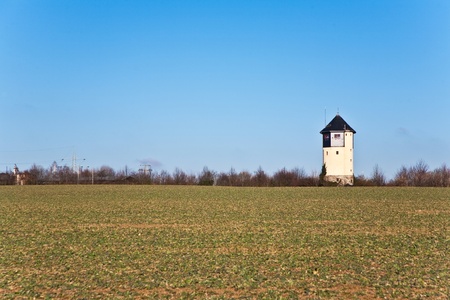 old Water tower in beautiful landscape with blue skyの写真素材