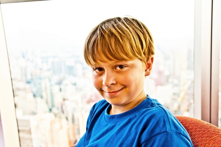 boy enjoys the view across Bangkok skylineの写真素材