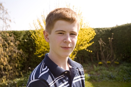 young red haired boy looking confident and happy