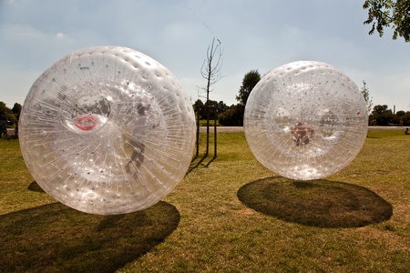 children have a lot of fun in the Zorbing Ballの写真素材