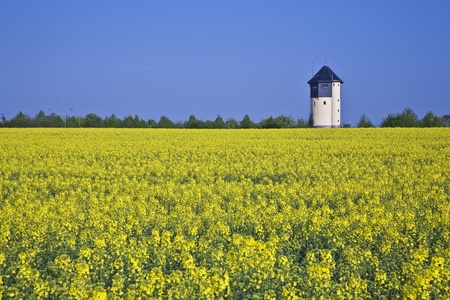 water tower in beautiful landscape with blue skyの写真素材