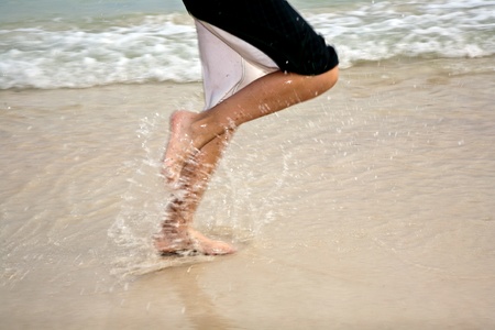 feet on the beautiful sandy beachの写真素材