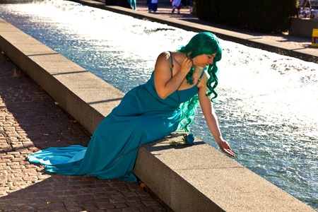 FRANKFURT, GERMANY - OCTOBER 10: Public day at Frankfurt international Book Fair, colorful girl made up as Manga from the Comic scene poses for photografers on October 10, 2010 in Frankfurt, Germany.のeditorial素材