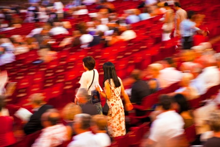 VERONA, ITALY - August 05: beautiful dressed people are searching their chairs in the famous opera of Verona  August 05,2009, Verona, Italy.のeditorial素材