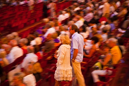 VERONA, ITALY - August 05: beautiful dressed people are searching their chairs in the famous opera of Verona  August 05,2009, Verona, Italy.のeditorial素材