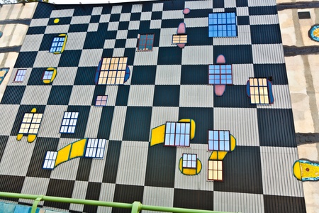 VIENNA, AUSTRIA - APRIL 25: Mosaic on the most famous District heating in Vienna of artist Hundertwasser in intensive afternoon light on April 25, 2009 in Vienna, Austria.のeditorial素材